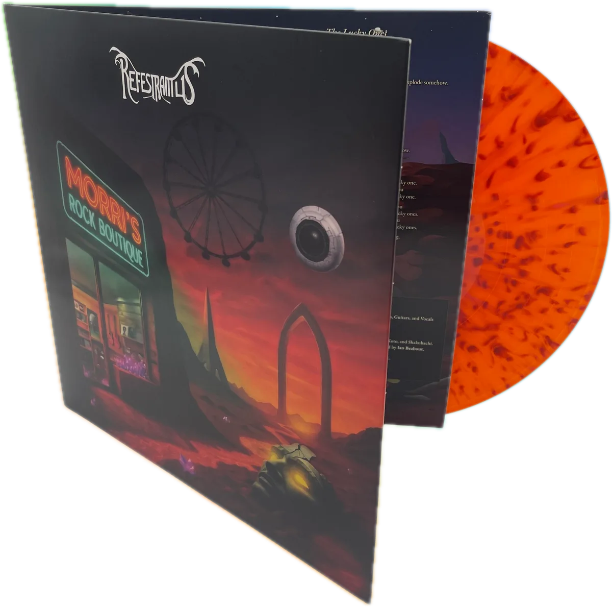 The front cover standing open, with the orange splatter disc showing behind it
